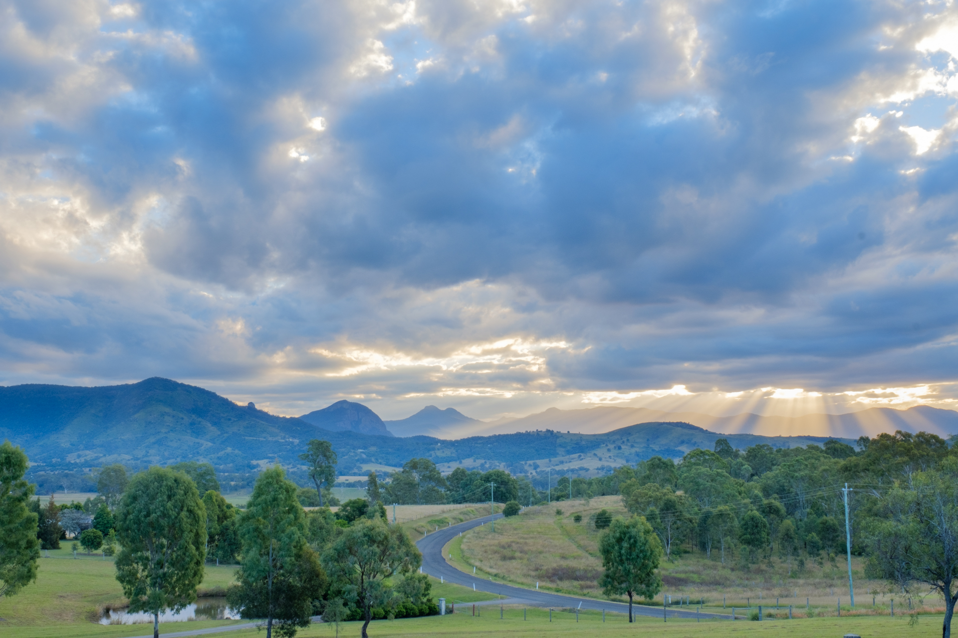 Landscape image sky road and distant hills